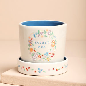 Ceramic Floral Mum Planter with “Lovely Mum” message surrounded by a pastel floral wreath.