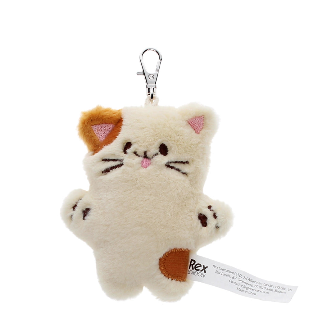 Cute plush cat bag charm showing embroidered whiskers and patch details.