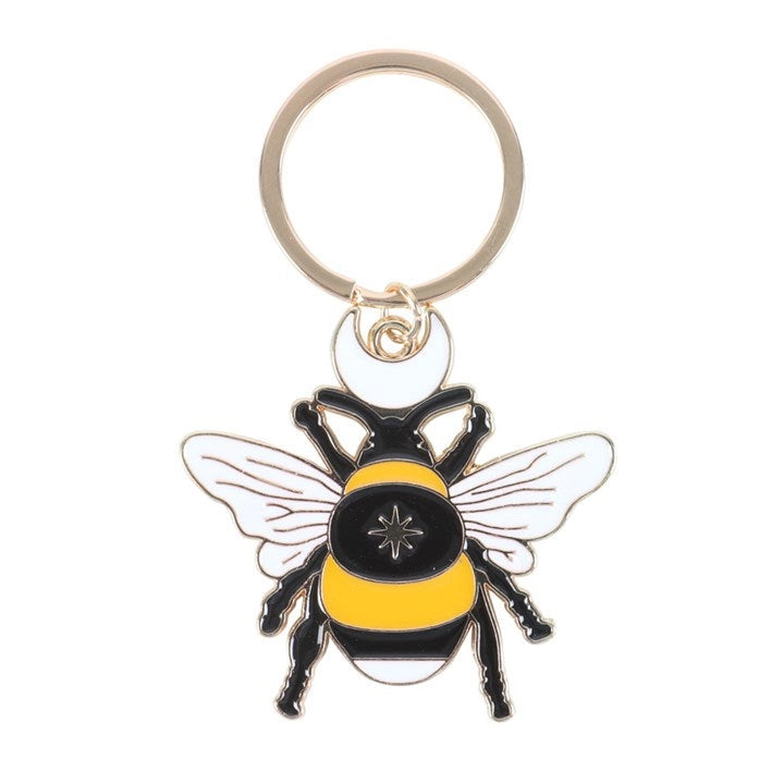 Close-up angled view of bee keyring showing enamel shine.