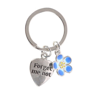 Close-up of the Forget-Me-Not Flower Keyring showing engraved heart and delicate floral detail.