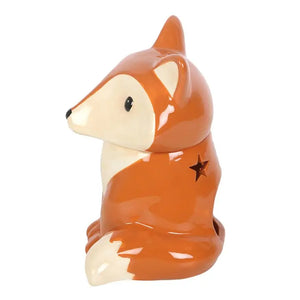 Side view of fox oil burner with star-shaped cut-out – Profile angle of the fox burner highlighting a star cut-out on the back for tealight glow.