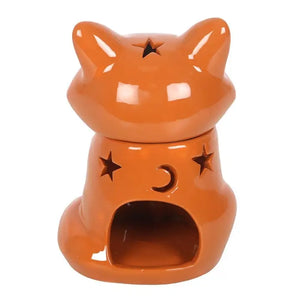 Back of ceramic fox wax warmer with star and moon cut-outs – Rear view showing the tealight compartment and glowing celestial cut-out shapes, adding a cosy ambience.