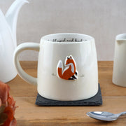 Fox Stoneware Mug on slate coaster with embossed fox design.