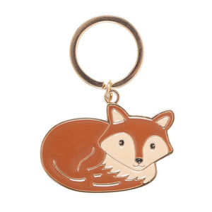 Close-up of Freddie Fox enamel keyring with orange and cream fox design on gold ring.