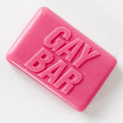 Hot-pink novelty soap bar embossed “GAY BAR” on white background – rose-scented LGBTQ+ gift from Contempo.