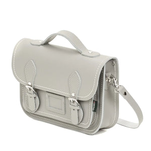 Side view of the Ghost Grey leather satchel. It has the shoulder strap on the side. 