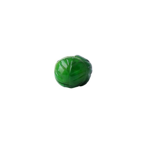 Back of glossy green Brussels sprout ornament showing leaf detailing.