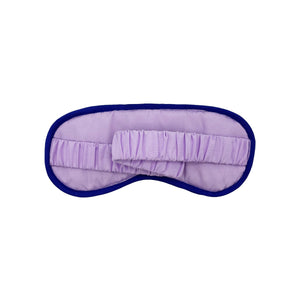 Flat lay of Go Away I’m Busy velvet eye mask with embroidered text and colourful design.