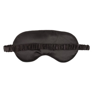 Black GO AWAY eye mask with branded card, styled on bold monochrome backdrop – ideal quirky gift for nap lovers.