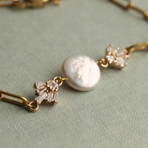 Close-up of the Gold Art Deco Freshwater Pearl Bracelet showcasing its pearl centrepiece and geometric crystal accents.