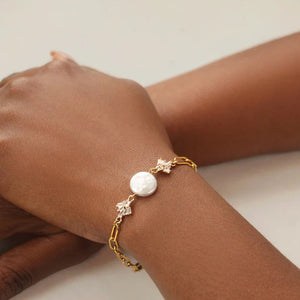 Model wearing the Gold Art Deco Freshwater Pearl Bracelet, highlighting its adjustable chain and elegant design.