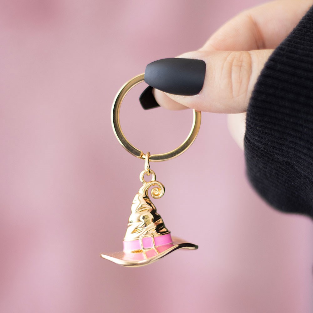 Gold witch hat keyring with pink enamel band – Good Witch Social Club design.
