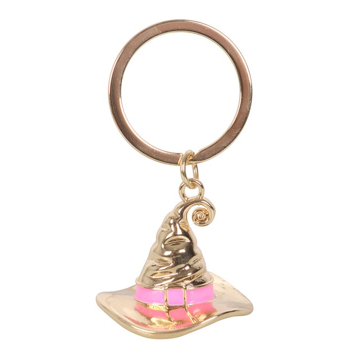 Gold-tone metal witch hat keyring with pink band, engraved Good Witch text.