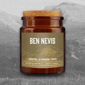 Great Plains Ben Nevis candle in brown glass jar with cork lid and mountain-inspired label reading Persistence, Determination, Triumph.