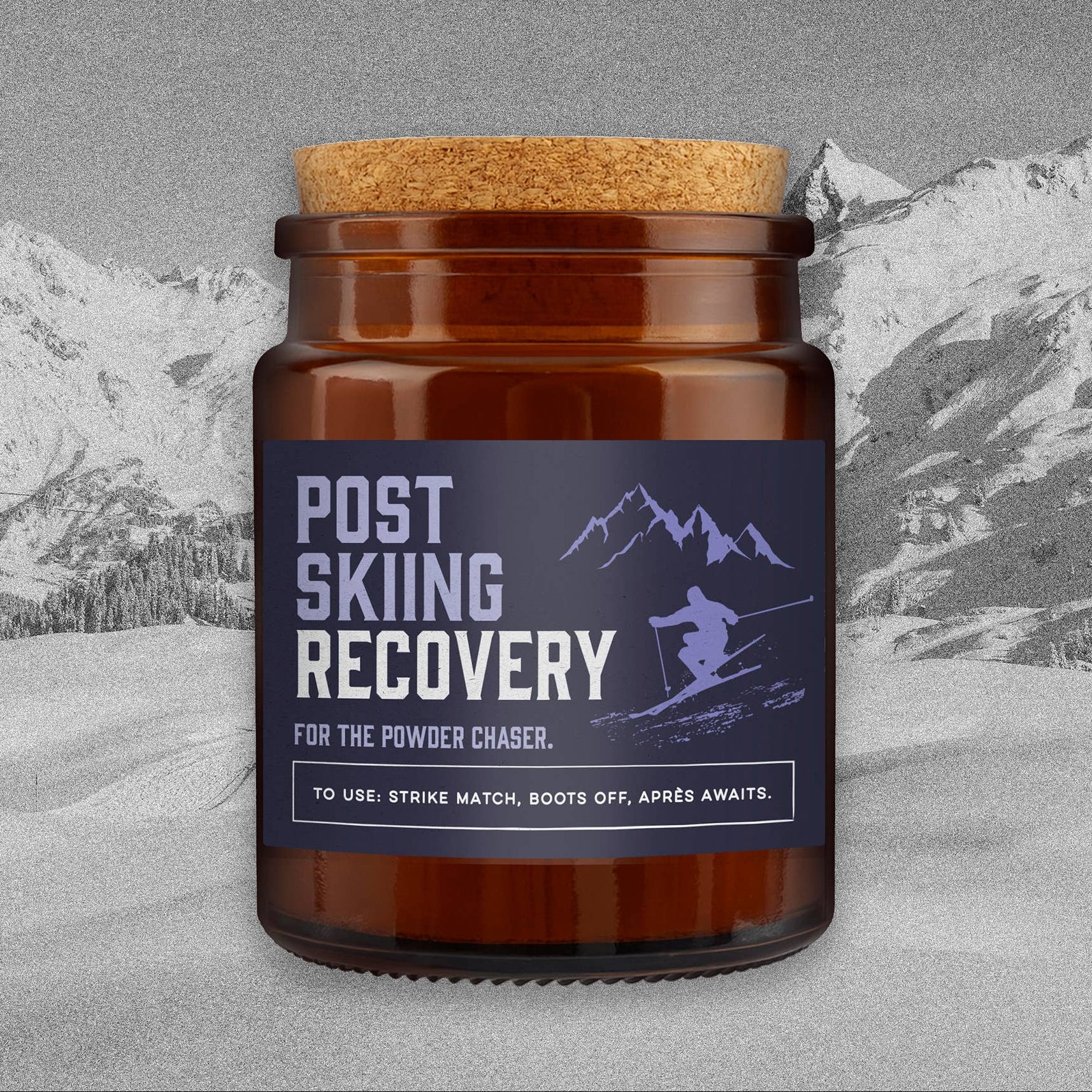 Great Plains Post Skiing Recovery candle in brown glass jar with cork lid and navy label reading For the Powder Chaser.