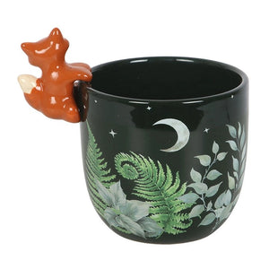 Rear angle of forest-themed ceramic plant pot showing leafy design and crescent moon with fox detail on the side