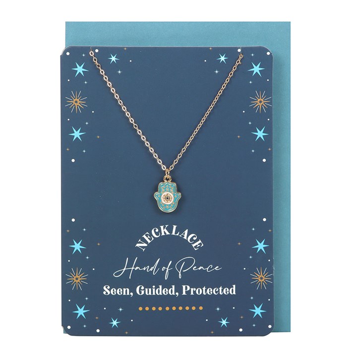 Hamsa necklace and star-themed greeting card set with matching turquoise envelope.