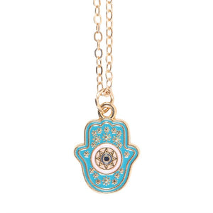 Close-up of turquoise Hamsa hand pendant on gold-tone chain.