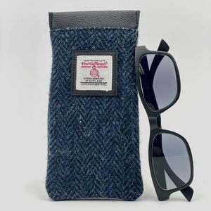 Harris Tweed Glasses Sleeve in Blue Herringbone. Soft lining protects eyewear from scratches and dust. Secure snap closure keeps glasses safe.