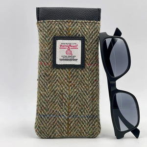 Harris Tweed Glasses Sleeve in Country Green. Soft lining protects eyewear from scratches and dust. Secure snap closure keeps glasses safe.