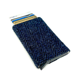 Angled view: Harris Tweed Pop-Up Card Holder in blue with cards visible, showcasing the pop-up mechanism.