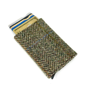 Angled view: Harris Tweed Pop-Up Card Holder in country green with cards visible, showcasing the pop-up mechanism.