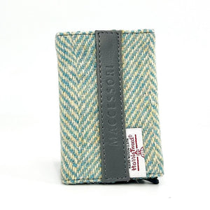 Front view: Harris Tweed Pop-Up Card Holder in turquoise highlighting the tweed pattern and vegan leather trim