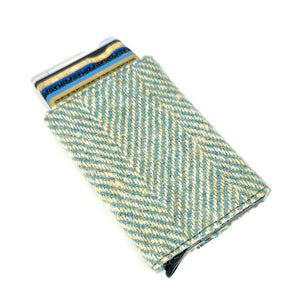 Angled view: Harris Tweed Pop-Up Card Holder in turquoise with cards visible, showcasing the pop-up mechanism.