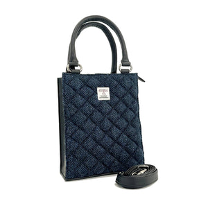 Angled view: Harris Tweed Mini Tote Bag in Blue, showcasing the quilted design and crossbody strap.