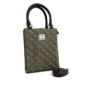 Angled view: Harris Tweed Mini Tote Bag in Country Green, showcasing the quilted design and crossbody strap.