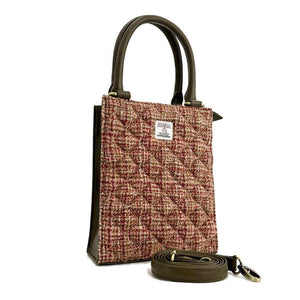 Angled view: Harris Tweed Mini Tote Bag in Maple, showcasing the quilted design and crossbody strap.