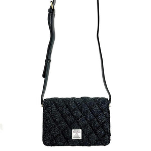 Strap view: Harris Tweed Quilted Shoulder Bag in charcoal with strap extended, showcasing the adjustable length.