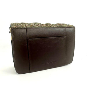 Back view: Harris Tweed Quilted Shoulder Bag in country green, focusing on the brown vegan leather trim.