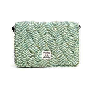 Front view: Harris Tweed Quilted Shoulder Bag in turquoise highlighting the quilted tweed.