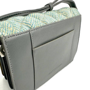 Back view: Harris Tweed Quilted Shoulder Bag in turquoise, focusing on the grey vegan leather trim