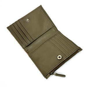 Angled view: Harris Tweed Slim Purse in maple, open to showcase the interior and card slots.