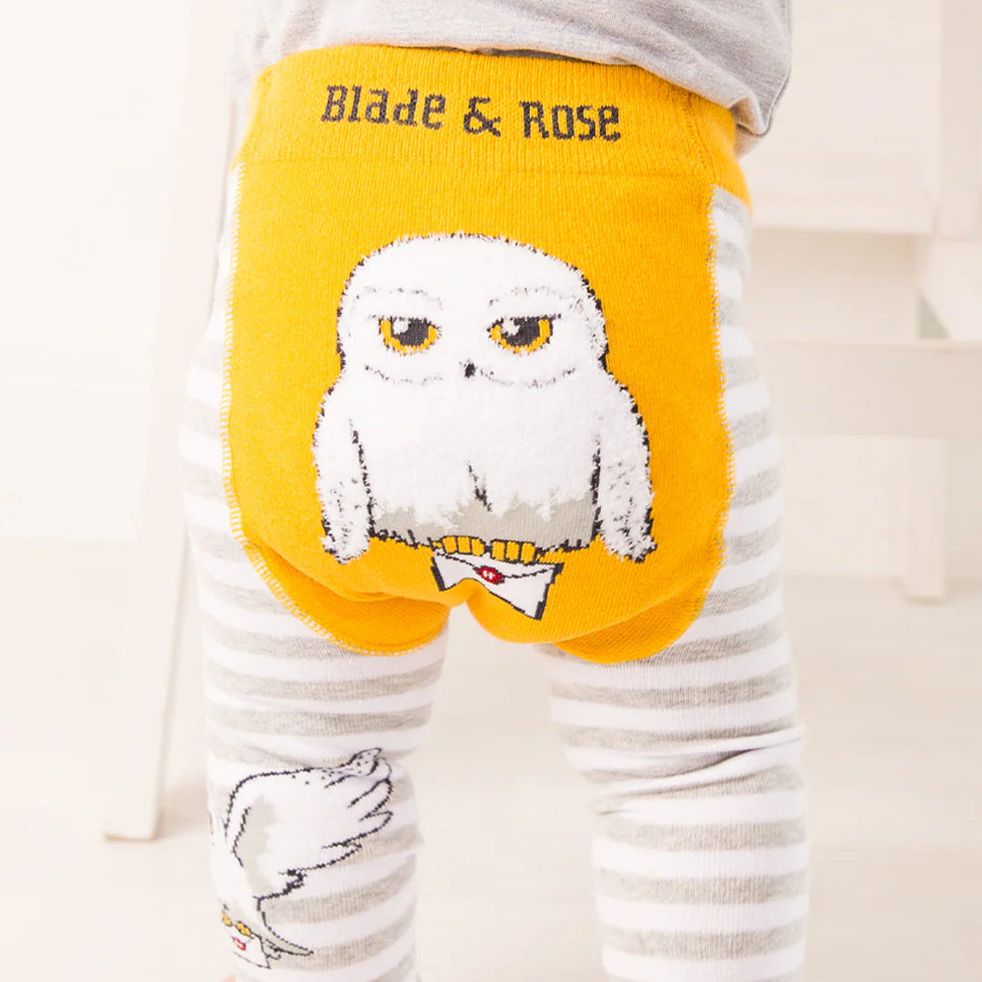 Baby wearing Harry Potter™ Hedwig leggings with yellow owl design on bum.