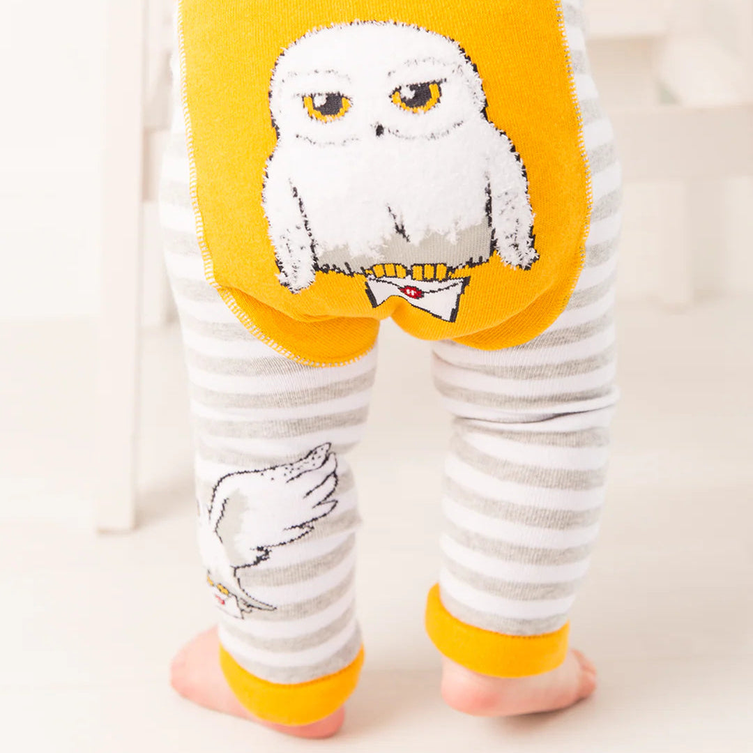Back view of Harry Potter™ Hedwig striped baby leggings with Hedwig motif.