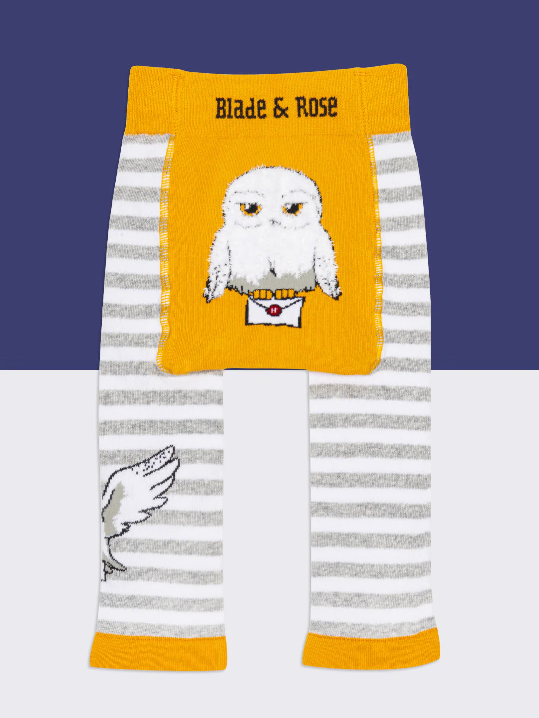 Baby sitting in Harry Potter™ Hedwig leggings with matching top and booties.