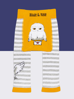 Baby sitting in Harry Potter™ Hedwig leggings with matching top and booties.