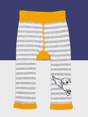 Rear view of Harry Potter™ Hedwig leggings with owl motif on leg.