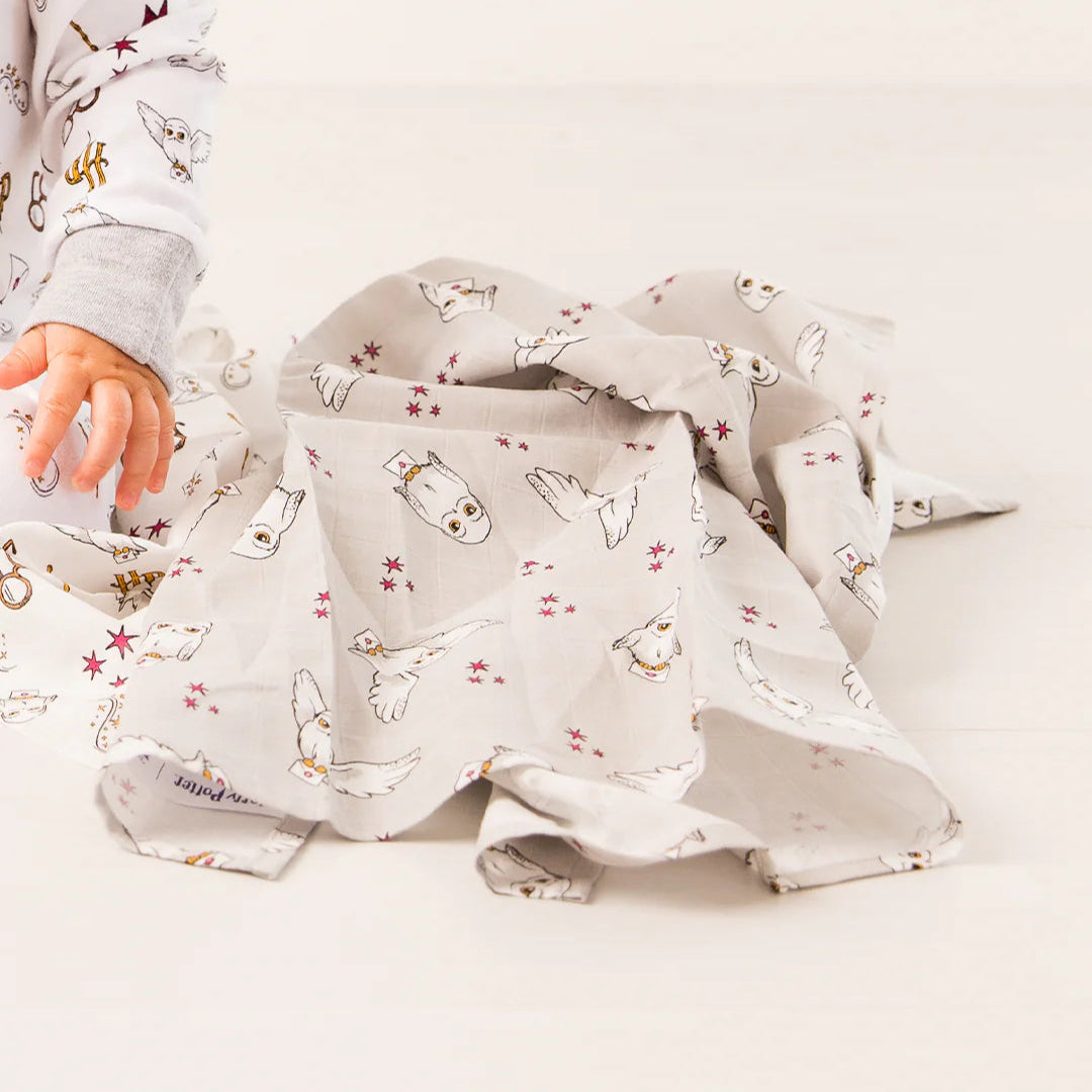 Baby using Harry Potter Hedwig muslin square – soft cotton comfort cloth.
