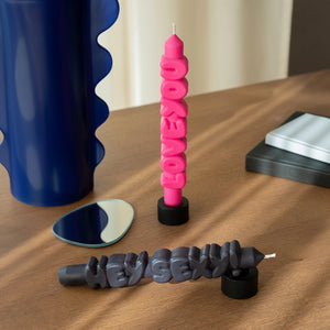 Hey Sexy and Love You statement taper candles styled on a wooden table with modern decor, showing their fun and flirty shape.