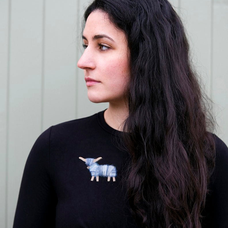 Soft blue wool Highland coo pin, delicate and charming.