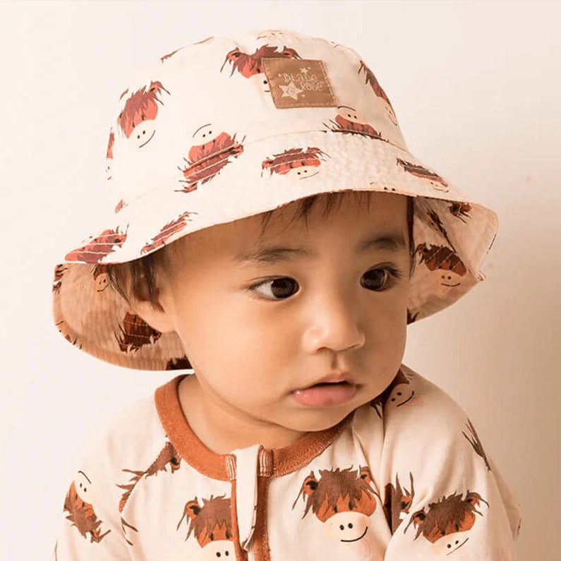 Cream highland cow bucket hat flat lay or worn view