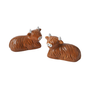 White background view of two Highland Cow salt and pepper shakers facing different angles