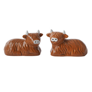 Front view of Highland Cow salt and pepper shakers side by side with visible shaker holes