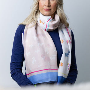 Model Wearing the Scarf in a Classic Loop – A chic styling example of the Hairy Coo Thistle Scarf, looped around the neck for warmth and versatility, complementing casual and formal outfits.