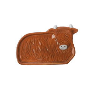Overhead view of the full Highland Cow-shaped ceramic tea bag rest.