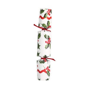 Single Holly White mini Christmas cracker standing upright with red ribbon ties, decorated with holly leaves, berries and red swirl print.
